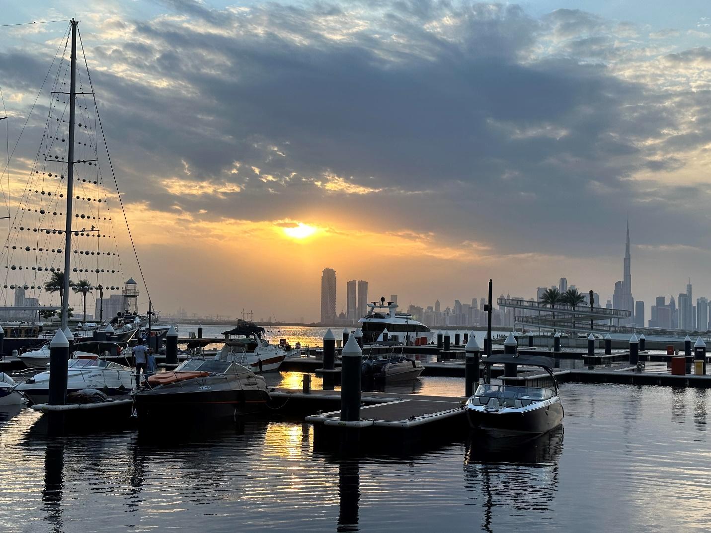 A group of boats in Dubai creek harbor