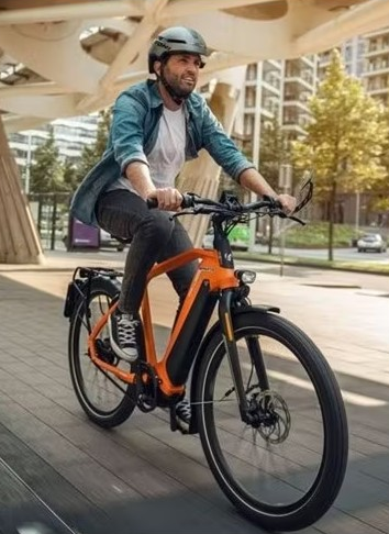 A person riding a bike Description automatically generated