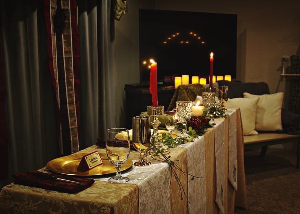 a table with candles and glasses on it