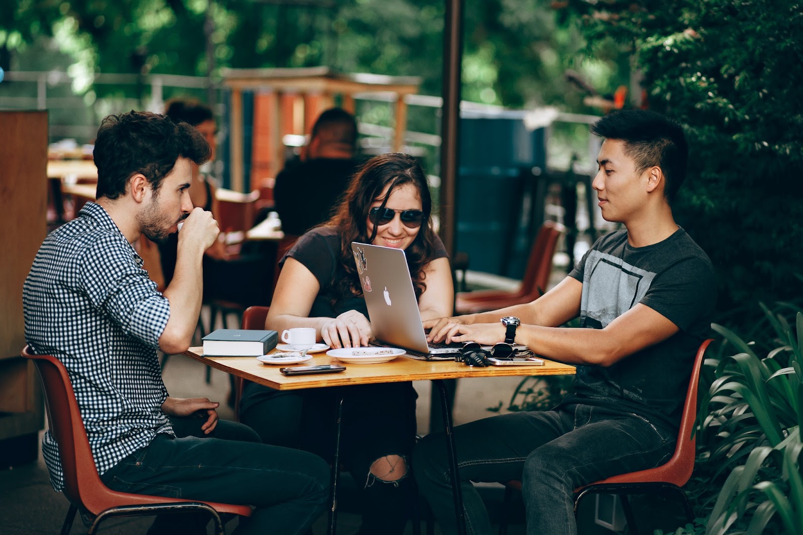 A team having a meeting about the SEO tools they plan to implement