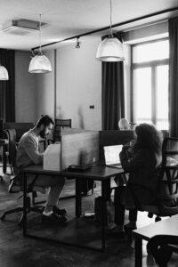 A group of people sitting at a desk