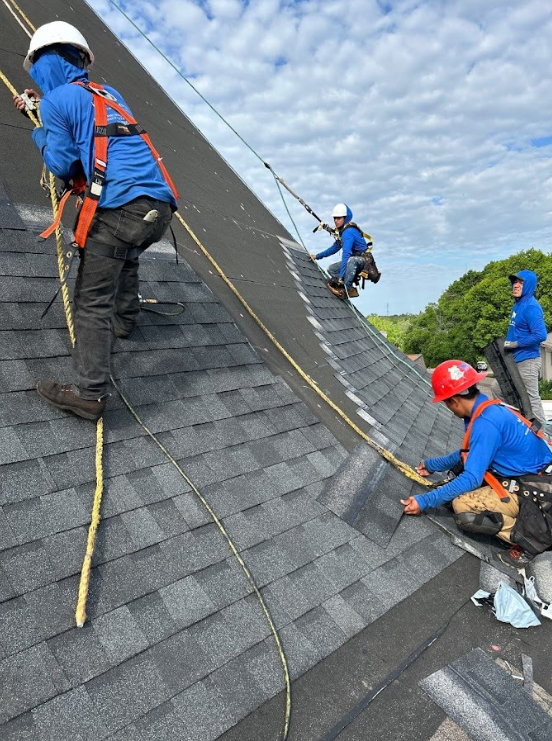 men removing and changing old roof