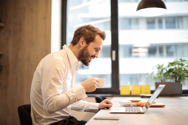 person performing dermatology medical billing on laptop