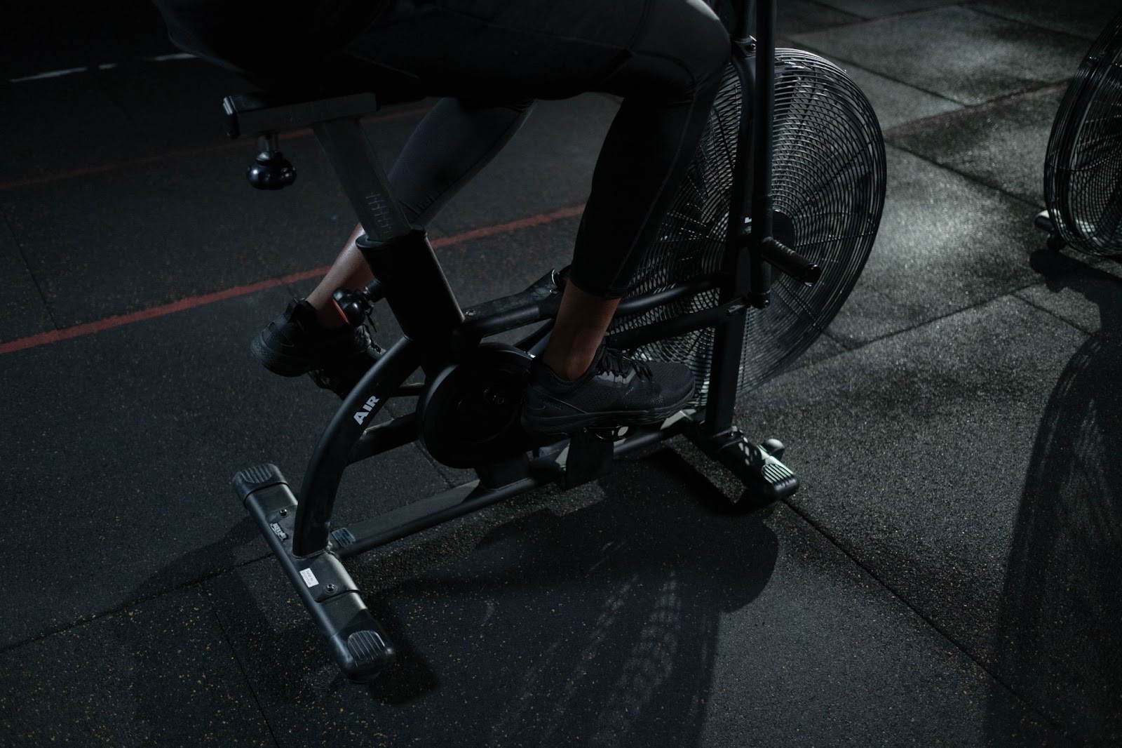 person using exercise bike
