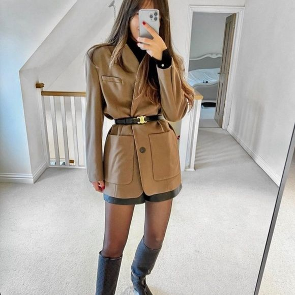 Picture of a lady rocking the Celine Belt with her coat