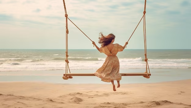 Woman on Beach Swing With Flowing Hair