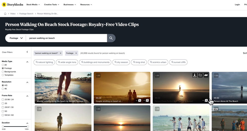 Storyblocks with 'person walking on beach' in the search box with Footage category selected
