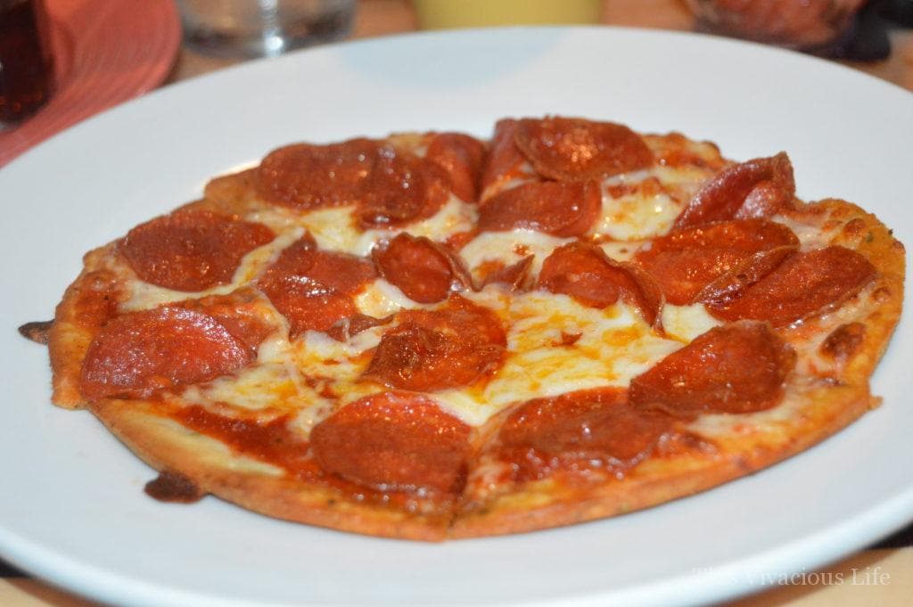 Gluten-free pepperoni pizza on a white plate