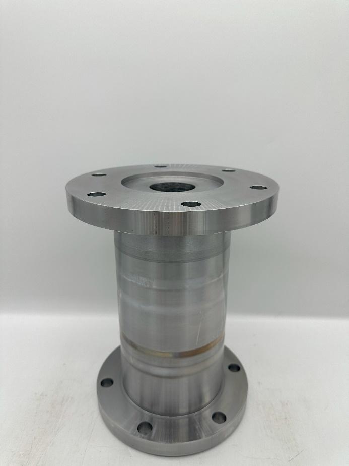 A metal cylinder with holes  Description automatically generated