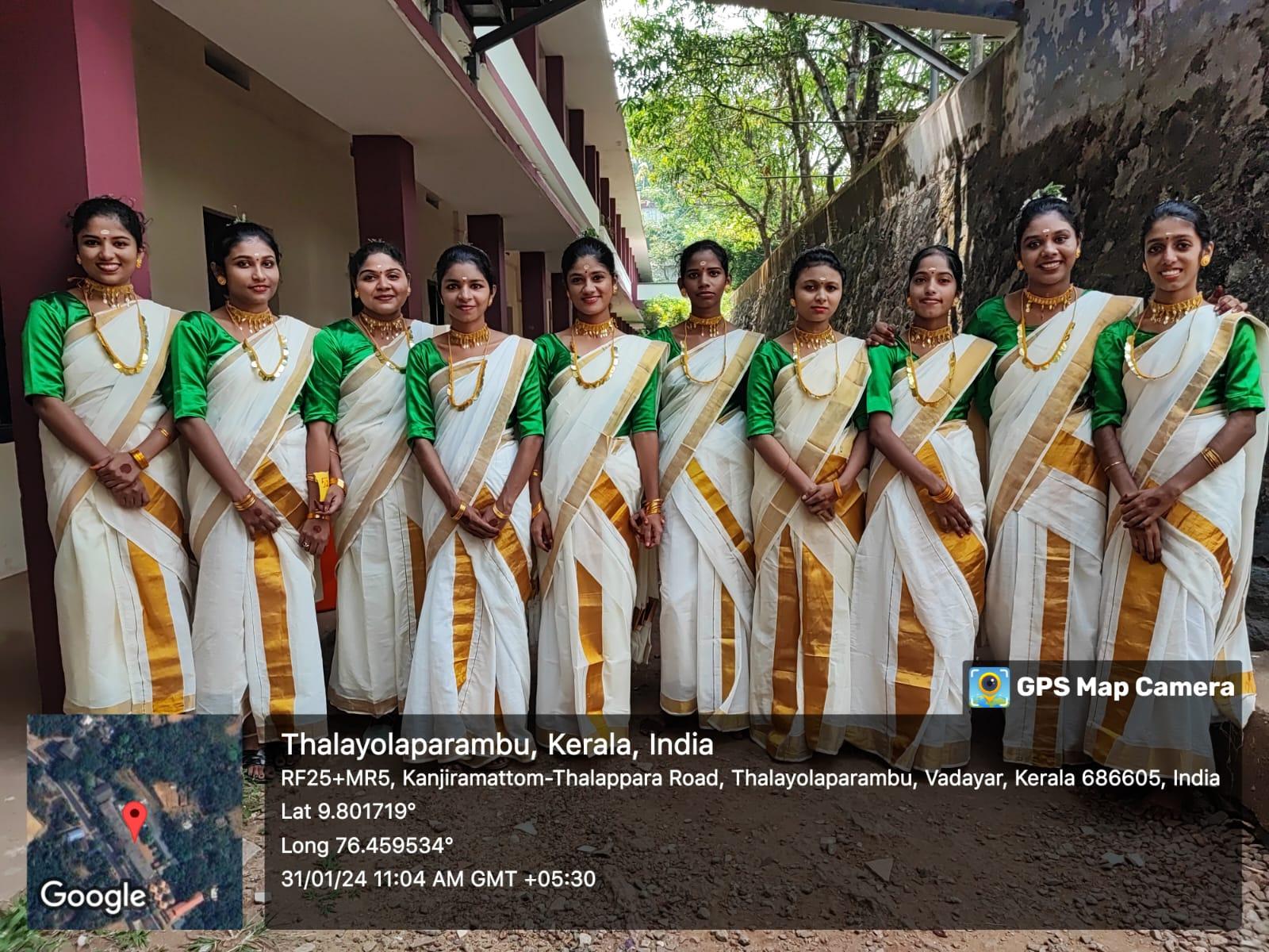 A group of women in traditional attire

Description automatically generated