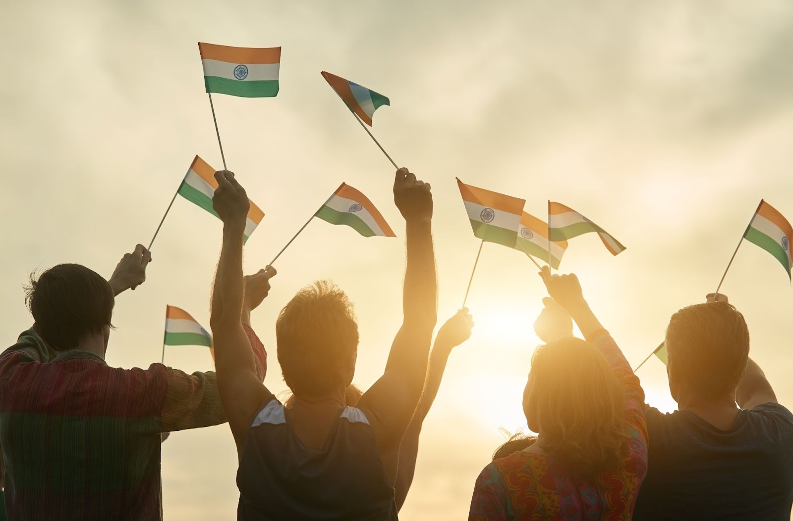 a groupof people holding up the indian flag 