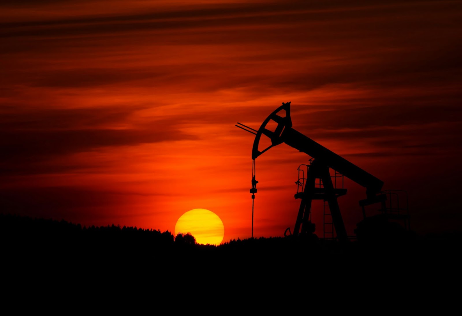 An oil rig at sunset.