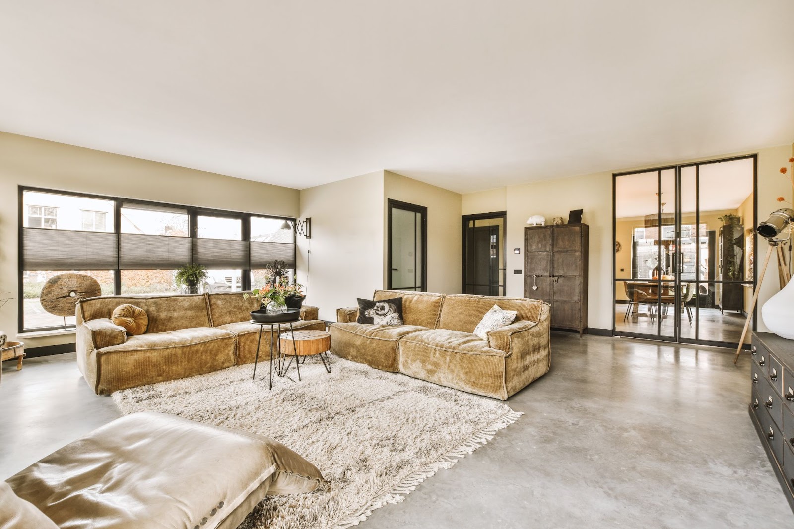 Living room with stained flooring. 