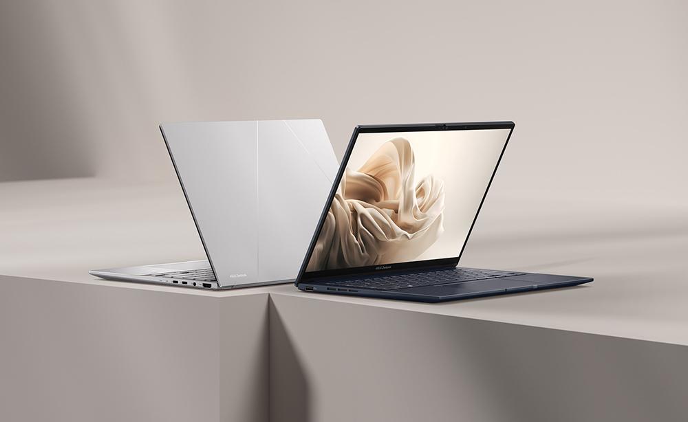 A laptops on a white surfaceDescription automatically generated