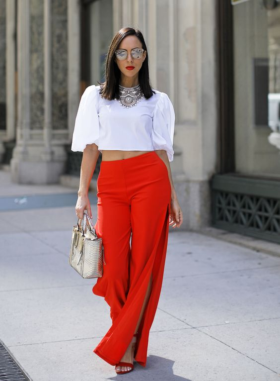 A crop top, wide-leg pants, and red shoes can be an elegant style