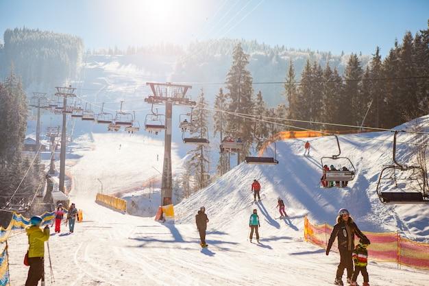 Free photo skiers on the ski lift riding up at ski resort