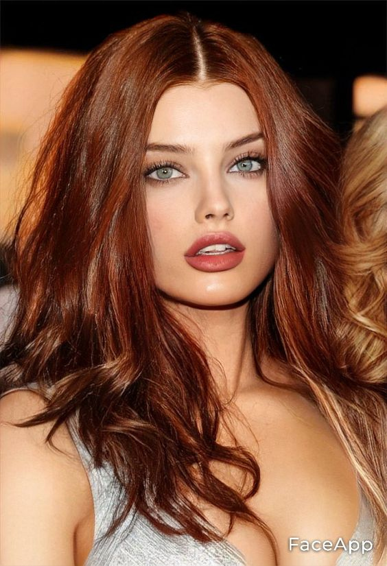 Picture showing a gorgeous lady rocking the stunning hair color in center part style 