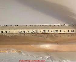 An example of a drywall date stamp on the side of the tape which is needed for drywall removal. 