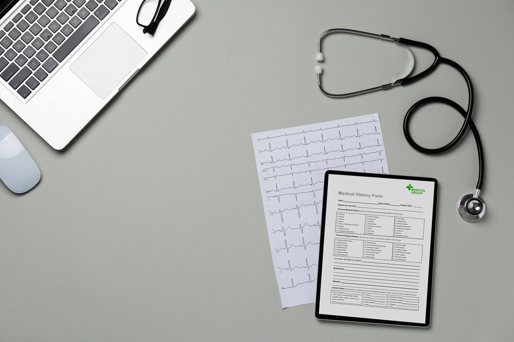 Top view of medical items, including stethoscope, clipboard, and medical books.