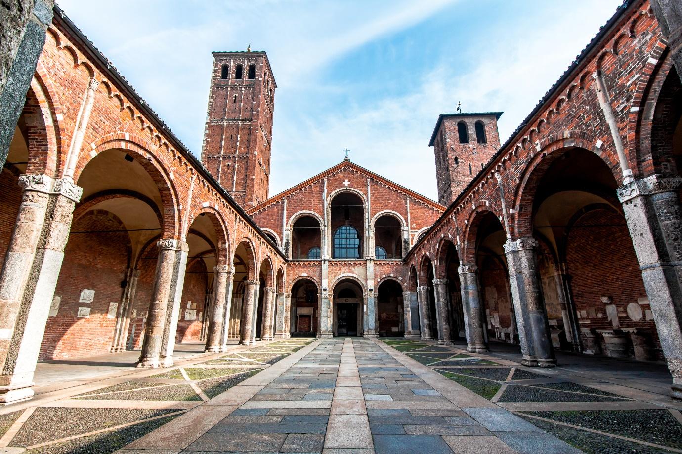 Basilica of Sant'Ambrogio with a stone walkway

Description automatically generated