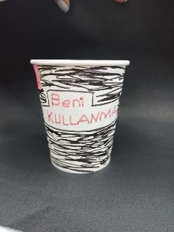 A picture containing text, paper cup, cup

Description automatically generated