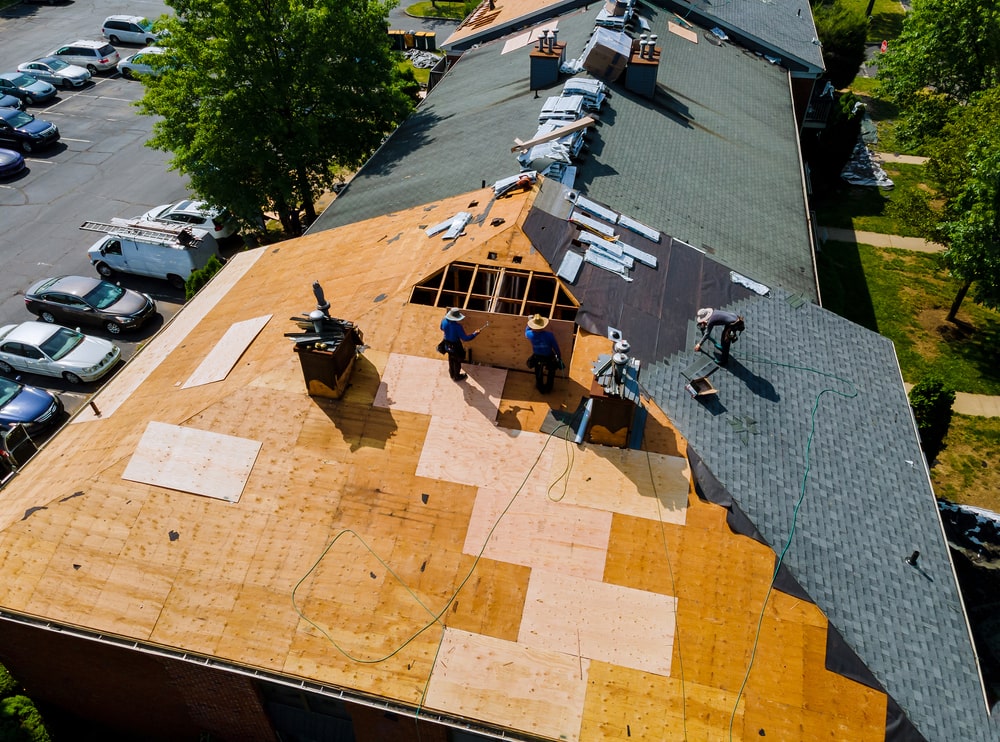 Workers checking Roof Size and Complexity