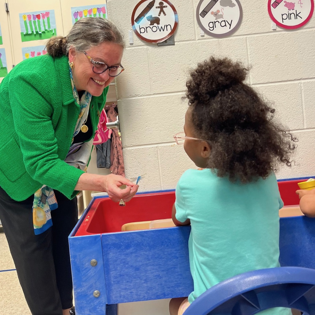 Dr. Reid with an Eagle View ES pre-K student