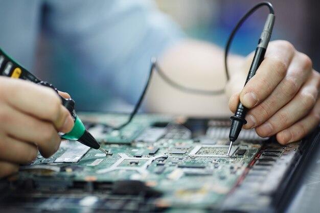 Free photo checking current in laptop circuit board