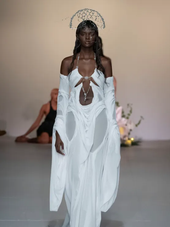 Picture of  a gorgeous model in a beautiful white dress for Di Peltsa