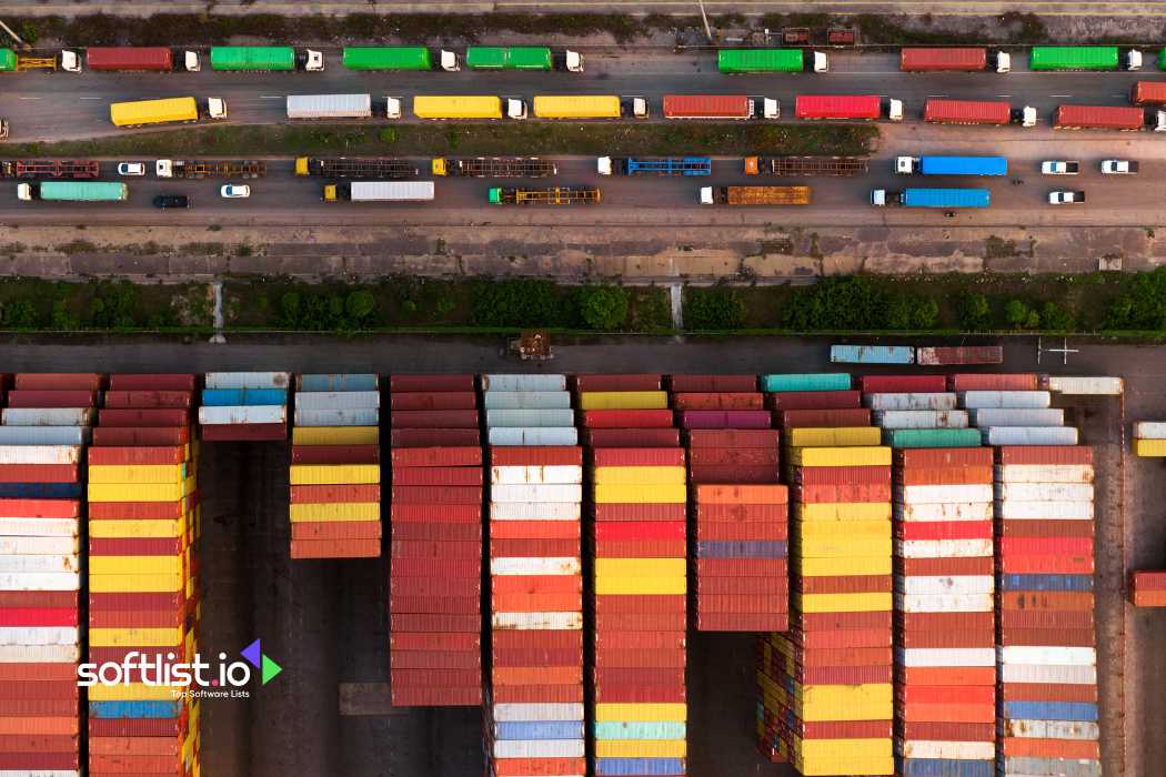 Aerial view of shipping containers and trucks at a port