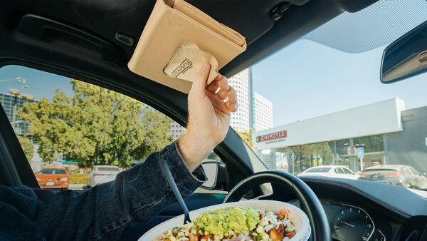Marketing strategy for restaurants examples: Chipotle’s car napkin holder in action.