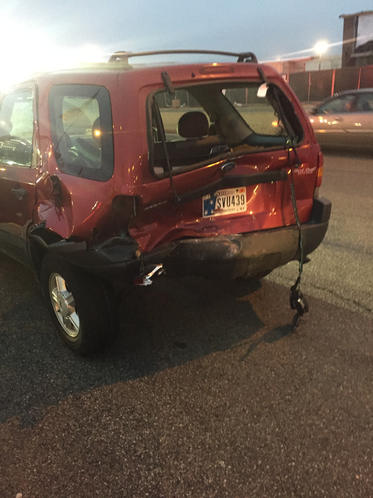 rear end collision damage in indiana, red car damaged in the back