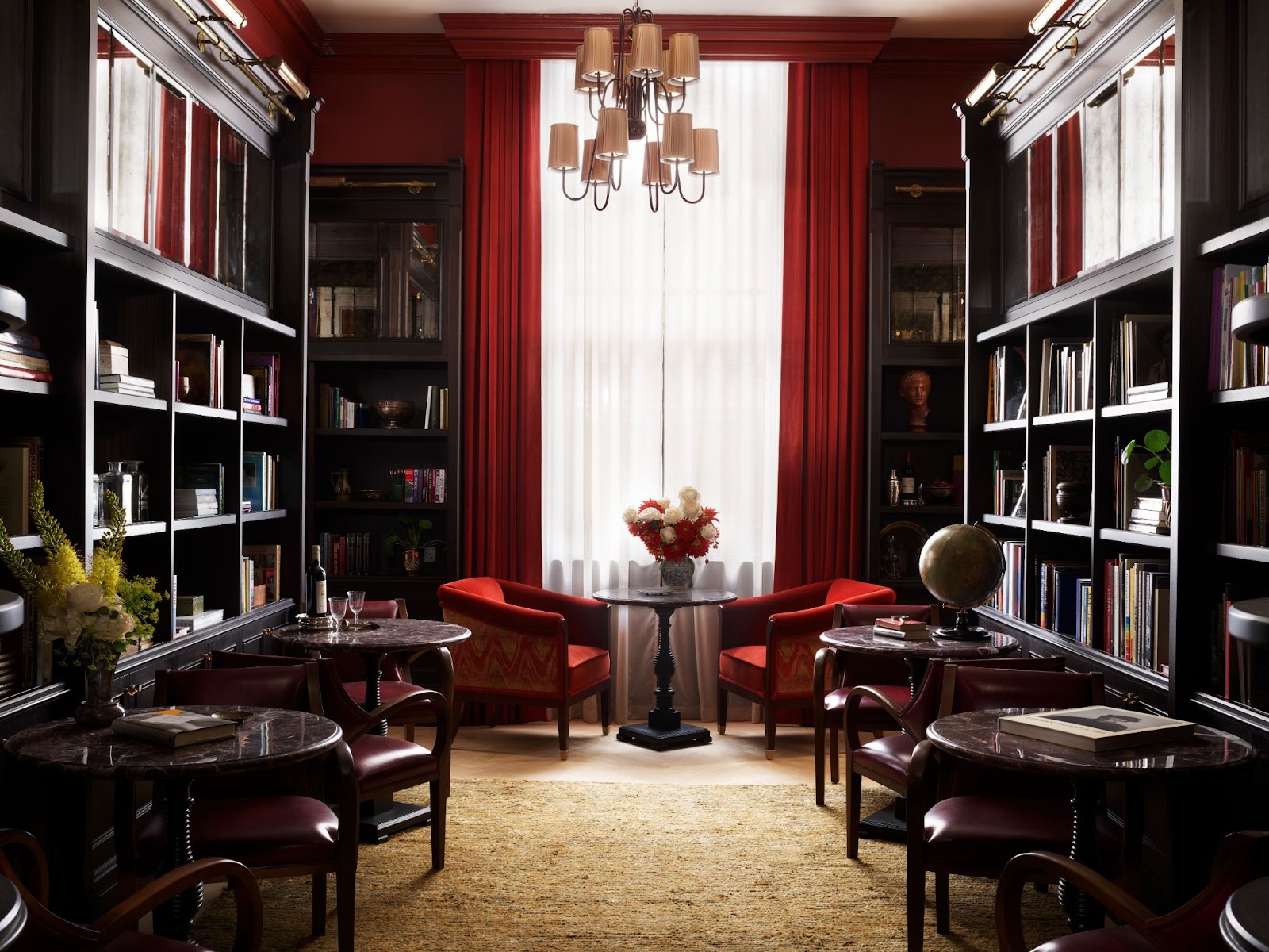 An image of Nomad London reading room with chairs and books.