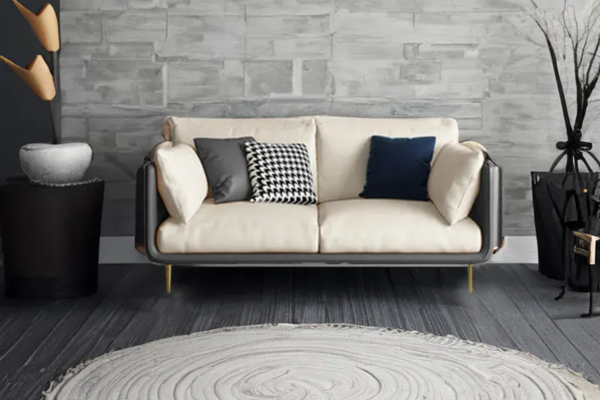 Grey 2-seater sofa in microfibre leather with carbon steel legs. Includes removable white cushions and two pillows.
