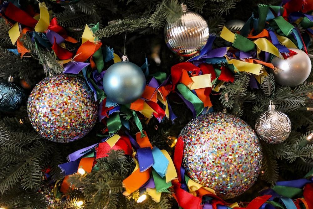 a close up of a christmas tree with ornaments