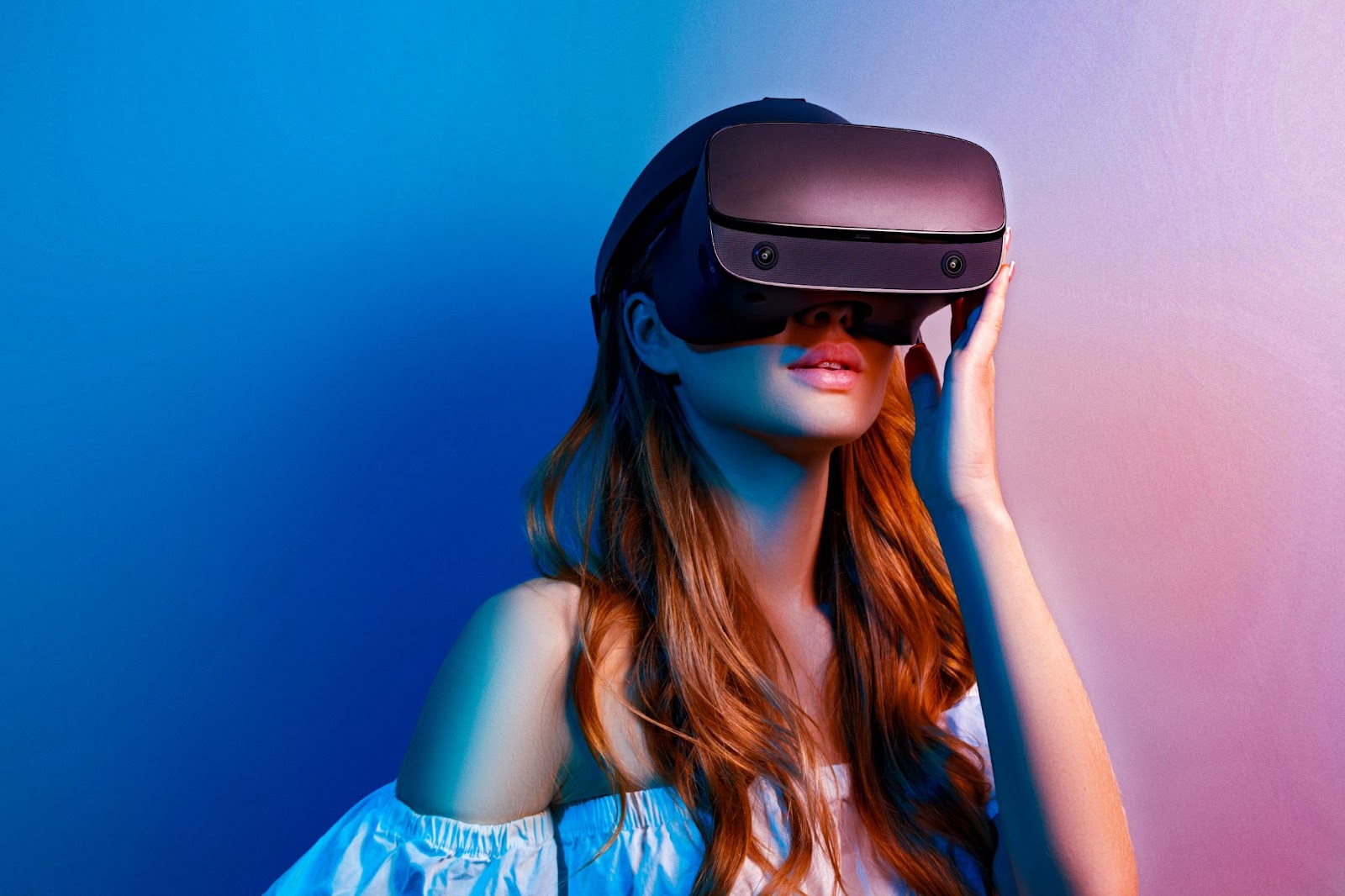 A woman immersed in a virtual reality experience with a headset on.