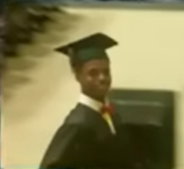 A person in a graduation cap and gown

Description automatically generated