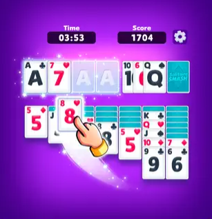 Screenshot of Solitaire Smash game in progress with a hand moving a card into place and the time elapsed and score displayed. 