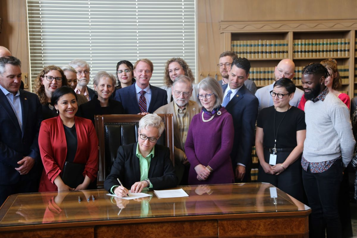 Tina signing campaign reform bill into law