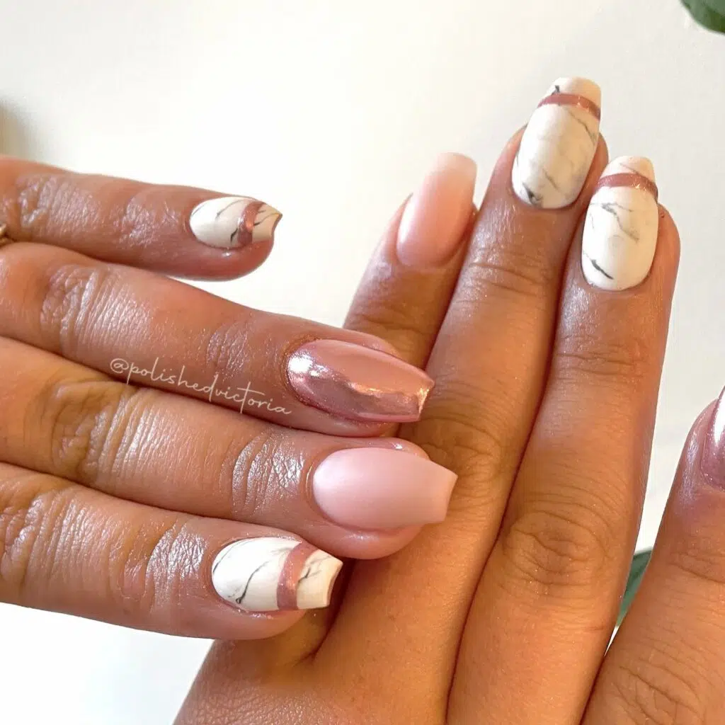 Full picture of a pale pink marble nail