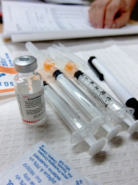 Flu vaccines and syringes