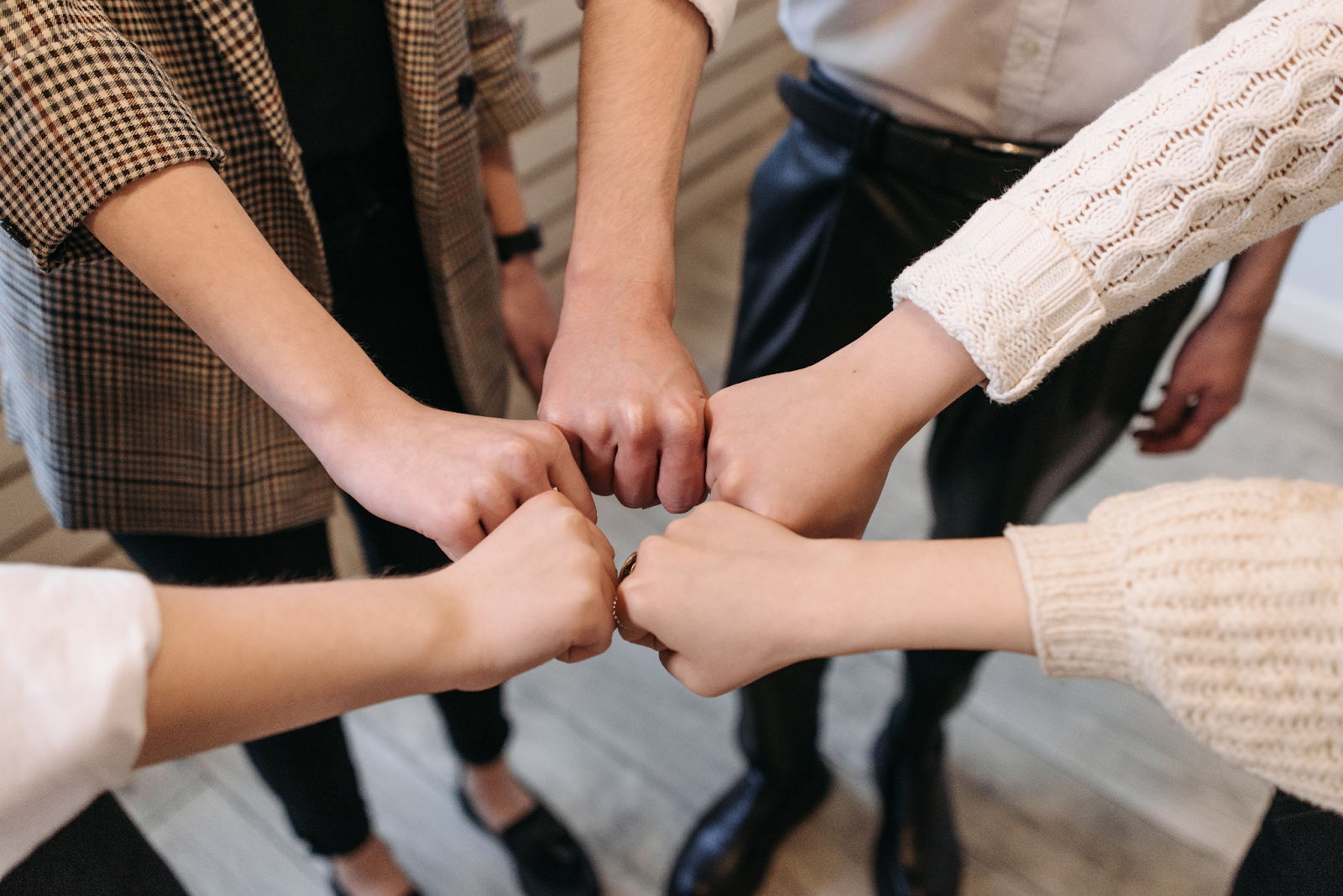 A group of people showing teamwork. 