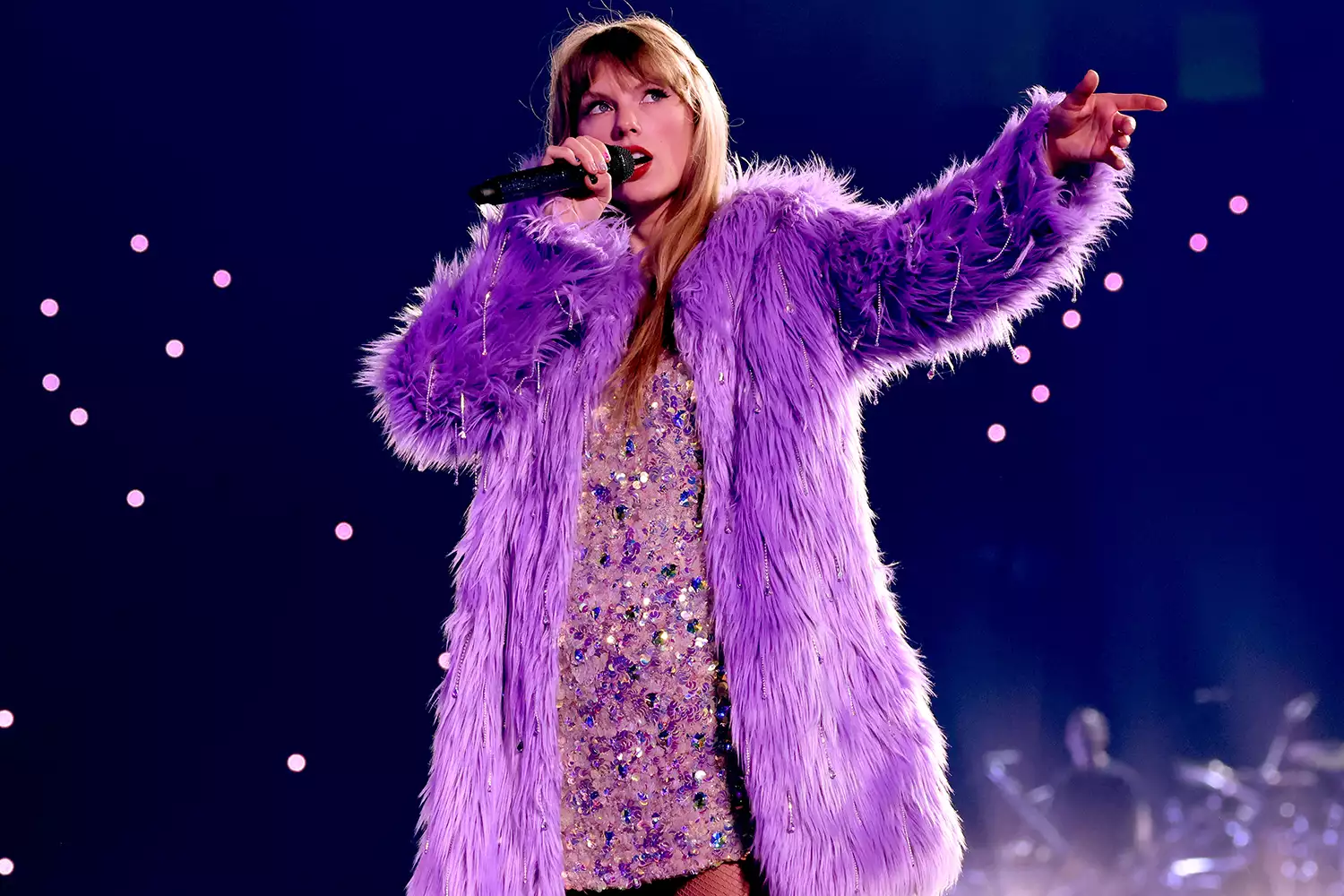 Picture of Taylor on a gorgeous faux fur coat for her midnight era set