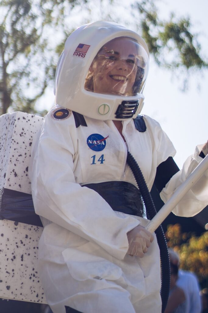 woman wearing a white and blue astronaut costume