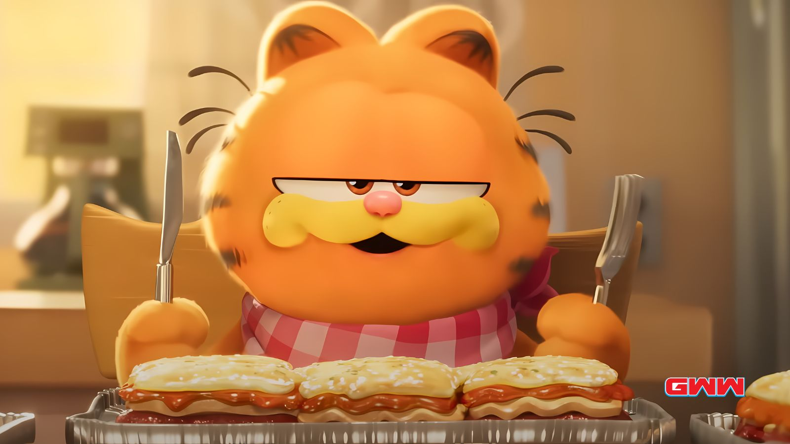 Orange cat Garfield in bib, ready to eat lasagna.