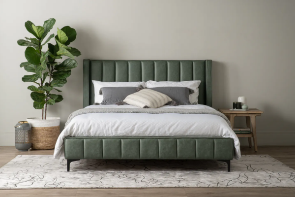 Dark green divan queen bed frame upholstered in fabric, featuring headboard and sturdy metal legs.