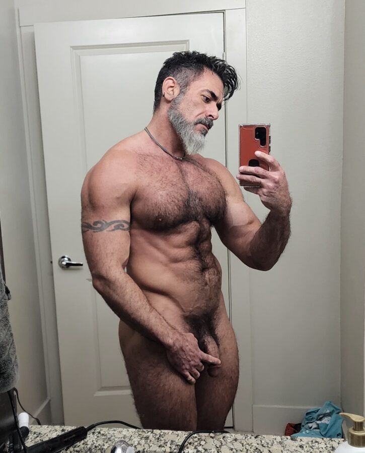 Lawson James taking an android smartphone selfie in the bathroom while touching his flaccid cut penis