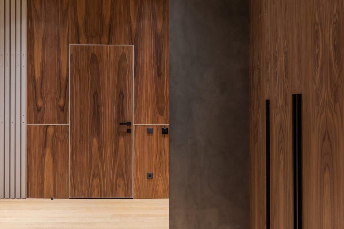 free wooden walls and door of contemporary house stock photo