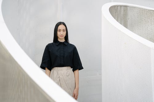 Free Elegant Woman Posing in Minimalist Interior Stock Photo