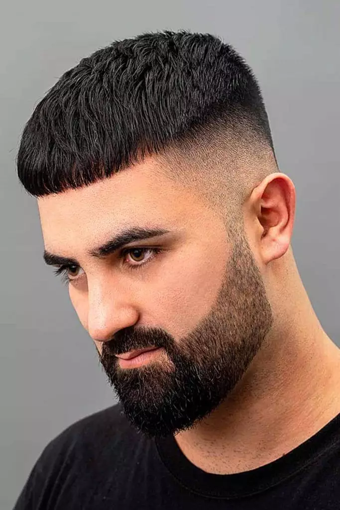 picture showing a guy rocking the thick cropped bang